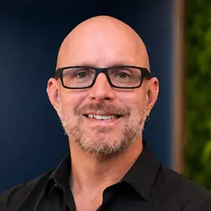 Headshot of Kevin Hutchinson of Peak Launch smiling, shown with his testimonial for Awespire Studios